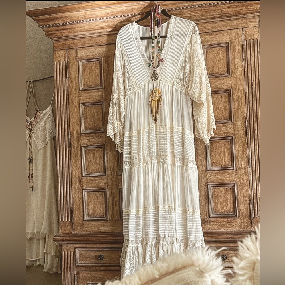 I fell in love with this dress and had to buy it. Never wore it.It’s beautiful,